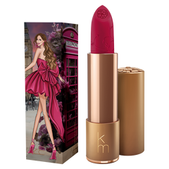 Pink lipstick with bronze casing and matching packaging featuring a woman in a pink dress.
