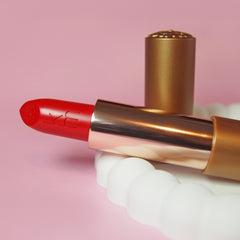 12 Rymba Rhythm - Natural Lipstick laying in a white dish 