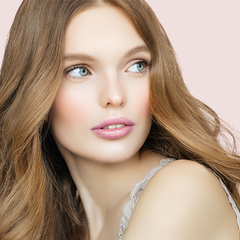 model with fair skin wearing light pink lipstick 