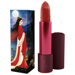 Lipstick with a decorative case featuring an illustration of a woman in a red dress against a night sky.