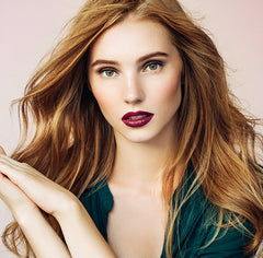 berry shade all natural lipstick on model